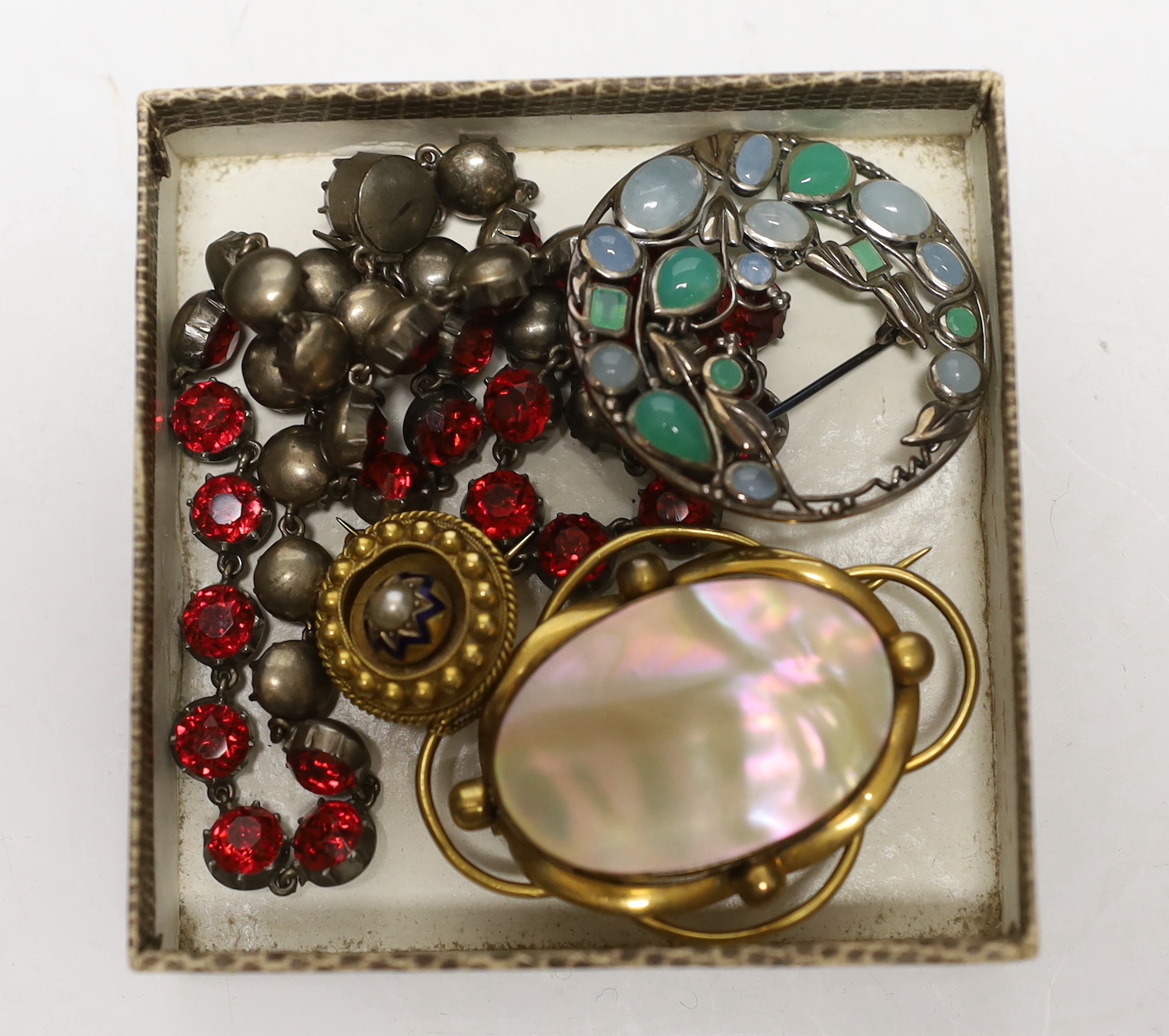 A late Victorian yellow metal, enamel and split pearl set circular brooch, 18mm, a modern 925 and gem set Sibyl Dunlop style brooch and two other items.